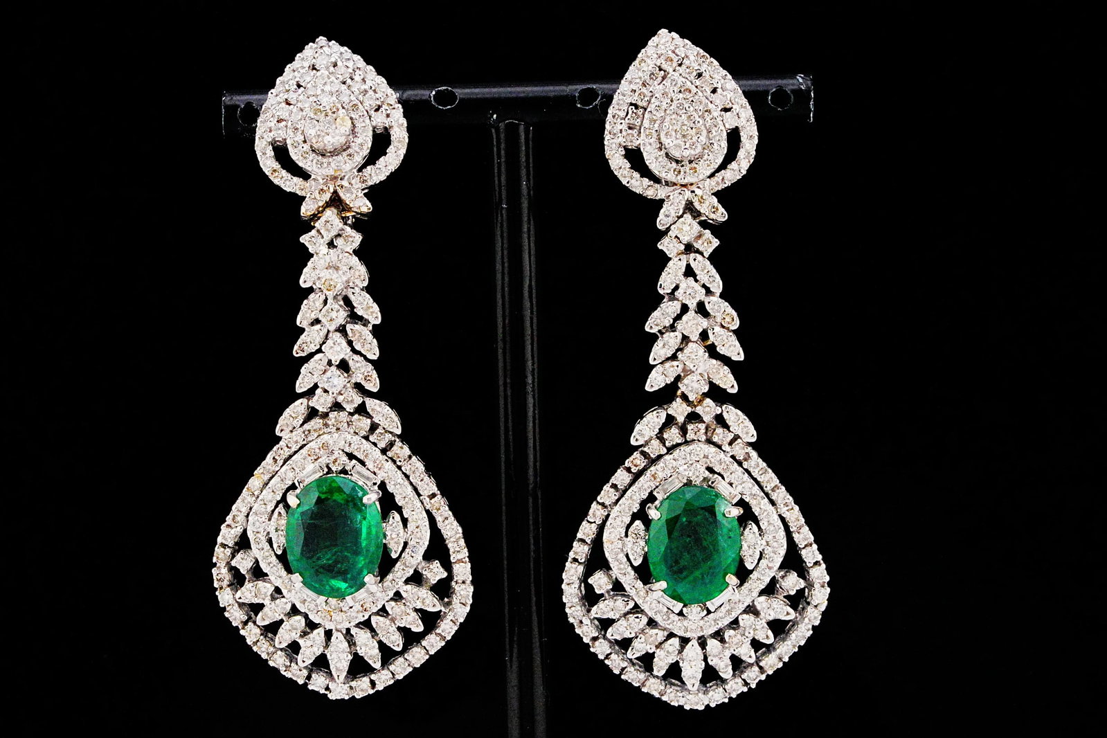 7.90ctw Emerald, 5.85ctw Diamond and 18K 2.75" Earrings: 7.90ctw Emerald, 5.85ctw VS1-SI1/G-H Diamond and 18K White Gold 2.75" Openwork Chandelier Earrings - THIS ITEM WILL COME WITH A $35,000 INSURANCE VALUATION REPORT. A magnificent expression of high jew