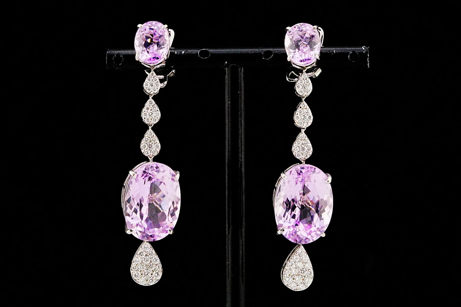 38.20ctw Kunzite, 1.30ctw Diamond, 18K 2.40" Earrings: 38.20ctw Kunzite, 1.30ctw VS1-SI1/G-H Diamond and 18K White Gold 2.40" Dangle Earrings - THIS ITEM WILL COME WITH A $26,000 INSURANCE VALUATION REPORT. A breathtaking display of feminine elegance and 