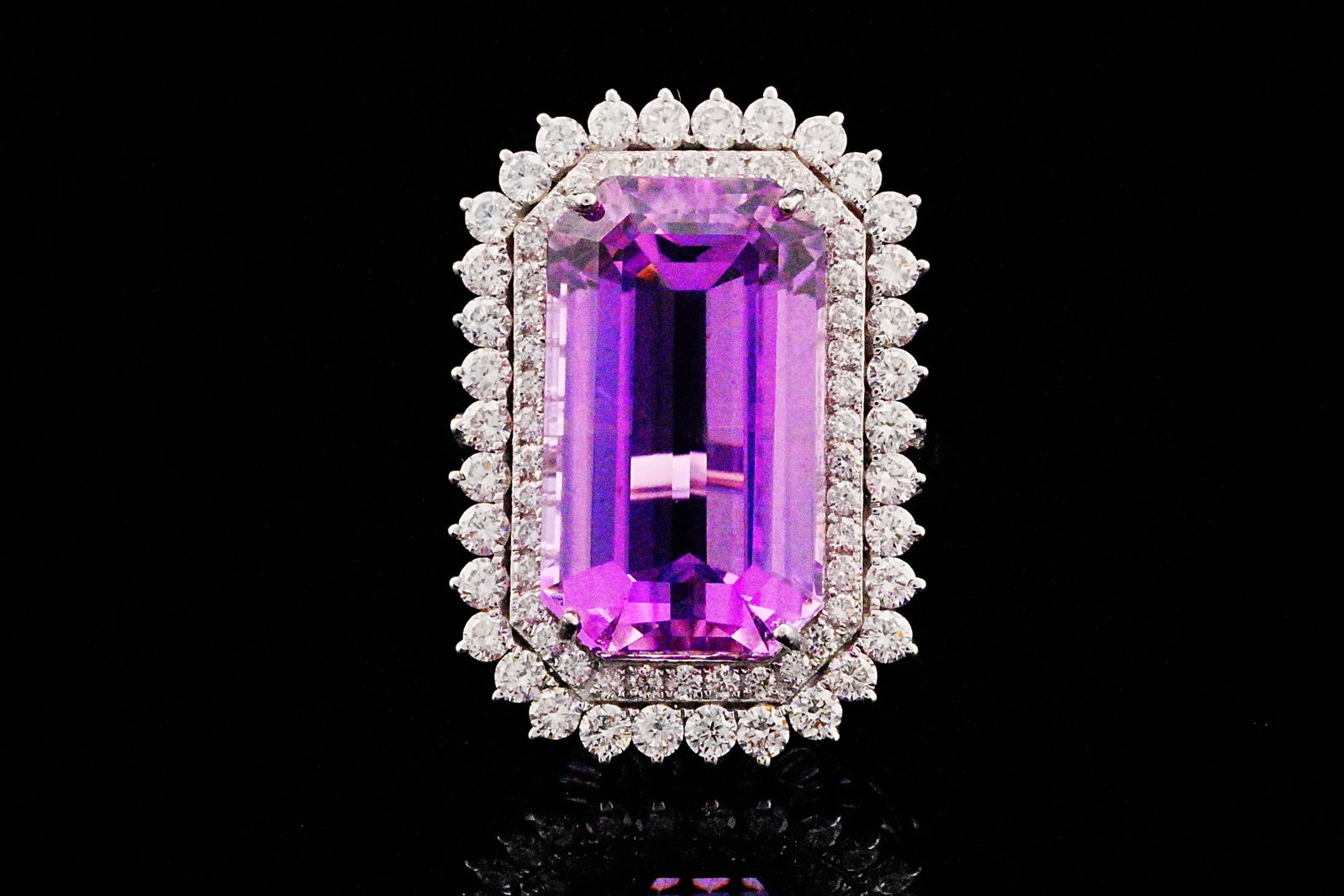19.80ct Kunzite, 1.65ctw Diamond, 18K White Gold Ring: 19.80ct Kunzite, 1.65ctw VS1-VS2/G-H Diamond and 18K White Gold Ring - THIS ITEM WILL COME WITH A $14,500 INSURANCE VALUATION REPORT. A breathtaking statement of exceptional gemstone beauty and refine