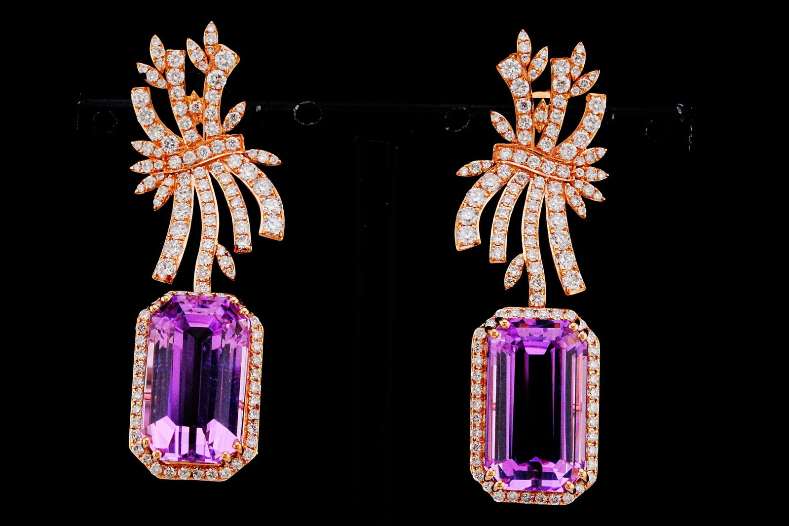 24.00ctw Kunzite, 2.25ctw Diamond and 18K Earrings: 24.00ctw Kunzite, 2.25ctw VS1-VS2/G-H Diamond and 18K Rose Gold 1.75" Drop Earrings - THIS ITEM WILL COME WITH A $25,000 INSURANCE VALUATION REPORT. A breathtaking display of color and brilliance, the