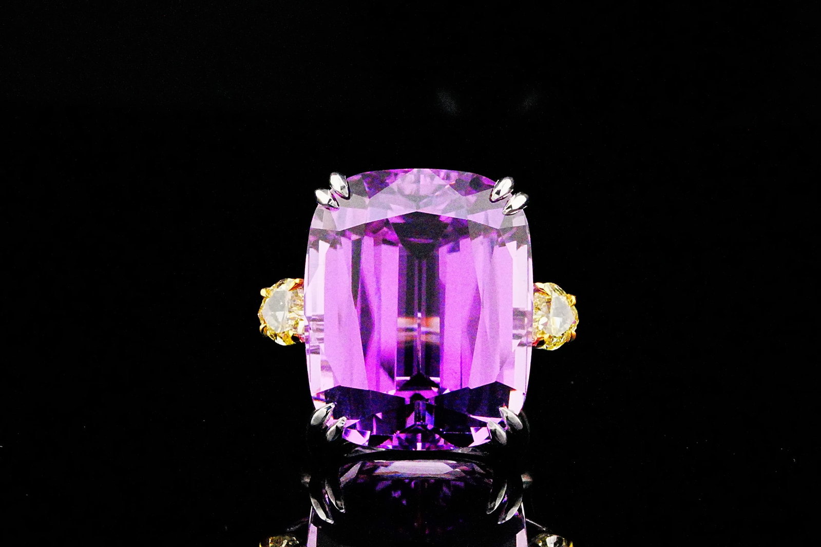 40ct Kunzite, 0.85ctw Fancy Yellow Diamond and 18K Ring: 40.00ct Kunzite, 0.85ctw VS Fancy Yellow Diamond and 18K White/Yellow Gold Ring - THIS ITEM WILL COME WITH A $26,000 INSURANCE VALUATION REPORT. A truly extraordinary statement of scale, rarity, and v