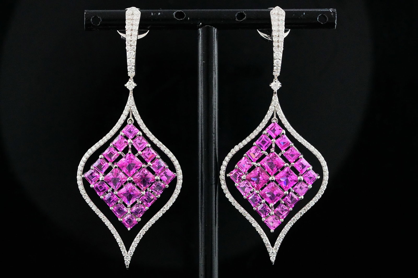 10.90ctw Pink Sapphire, 1.60ctw Diamond, 18K Earrings: 10.90ctw Pink Sapphire, 1.60ctw VS1-SI1/G-H Diamond and 18K White Gold 2.5" Dangle Earrings - THIS ITEM WILL COME WITH A $24,000 INSURANCE VALUATION REPORT. These elegant openwork dangle earrings feat