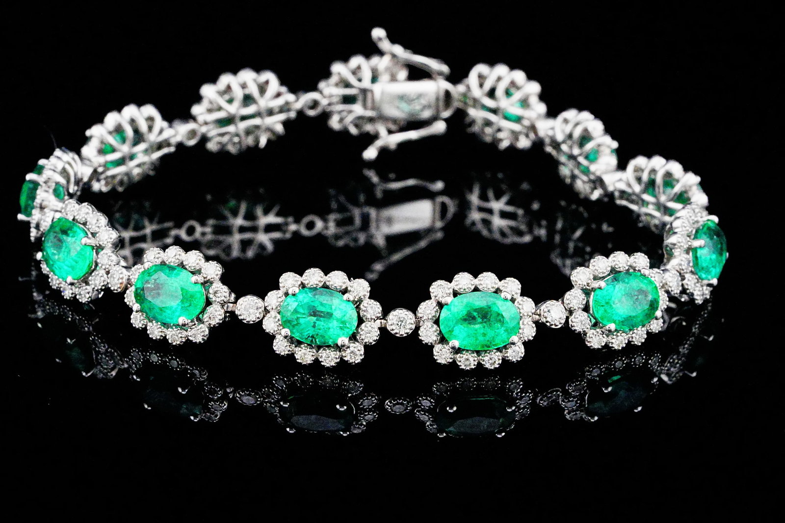 9.60ctw Emerald, 1.65ctw Diamond and 18K 7" Bracelet: 9.60ctw Emerald, 1.65ctw SI1-SI2/G-H Diamond and 18K White Gold 7" Bracelet - THIS ITEM WILL COME WITH A $38,000 INSURANCE VALUATION REPORT. Beautifully crafted in luxurious 18K white gold, this elega