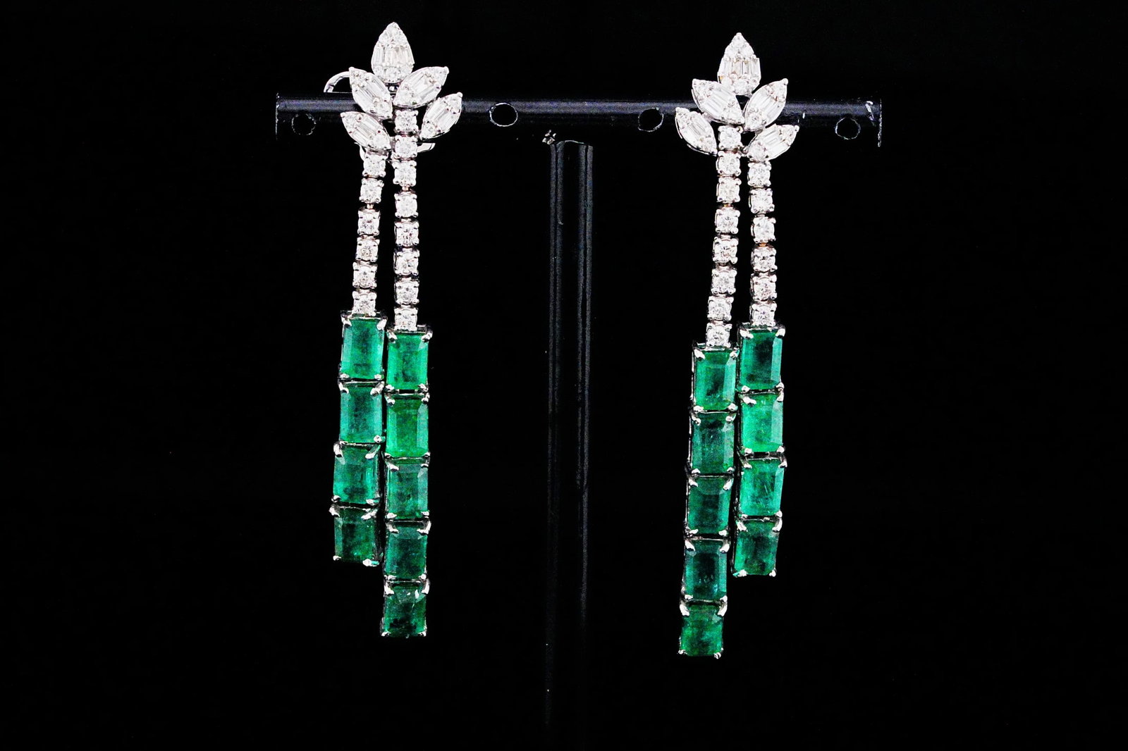 11.30ctw Emerald, 1.50ctw Diamond and 18K Earrings: 11.30ctw Emerald, 1.50ctw VS1-SI1/G-H Diamond and 18K White Gold 2.60" Tassel Drop Earrings - THIS ITEM WILL COME WITH A $28,500 INSURANCE VALUATION REPORT. Exquisitely crafted in luxurious 18K white 