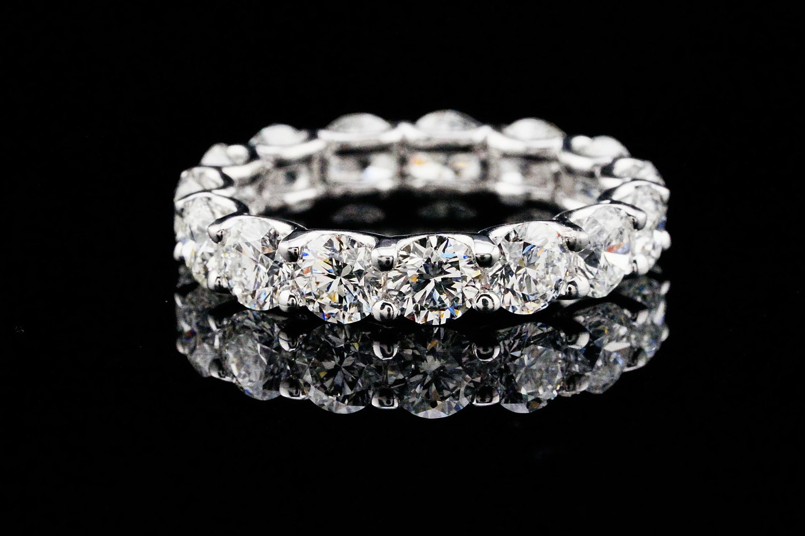 4.60ctw VS2-SI1/G-H Diamond and 14K Eternity Band: 4.60ctw VS2-SI1/G-H Round Brilliant Diamond and 14K White Gold 4.2mm Wide Eternity Band - THIS ITEM WILL COME WITH A $16,000 INSURANCE VALUATION REPORT. This timeless eternity band showcases a continu
