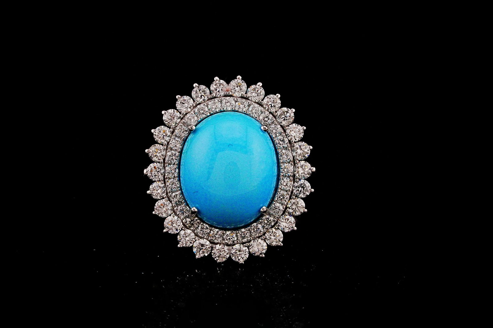 4.40ct Turquoise, 1.00ctw Diamond and 18K Ring: 4.40ct Turquoise, 1.00ctw SI1-SI2/G-H Diamond and 18K White Gold Ring - THIS ITEM WILL COME WITH A $7,500 INSURANCE VALUATION REPORT. Beautifully crafted in polished 18K white gold, this elegant state