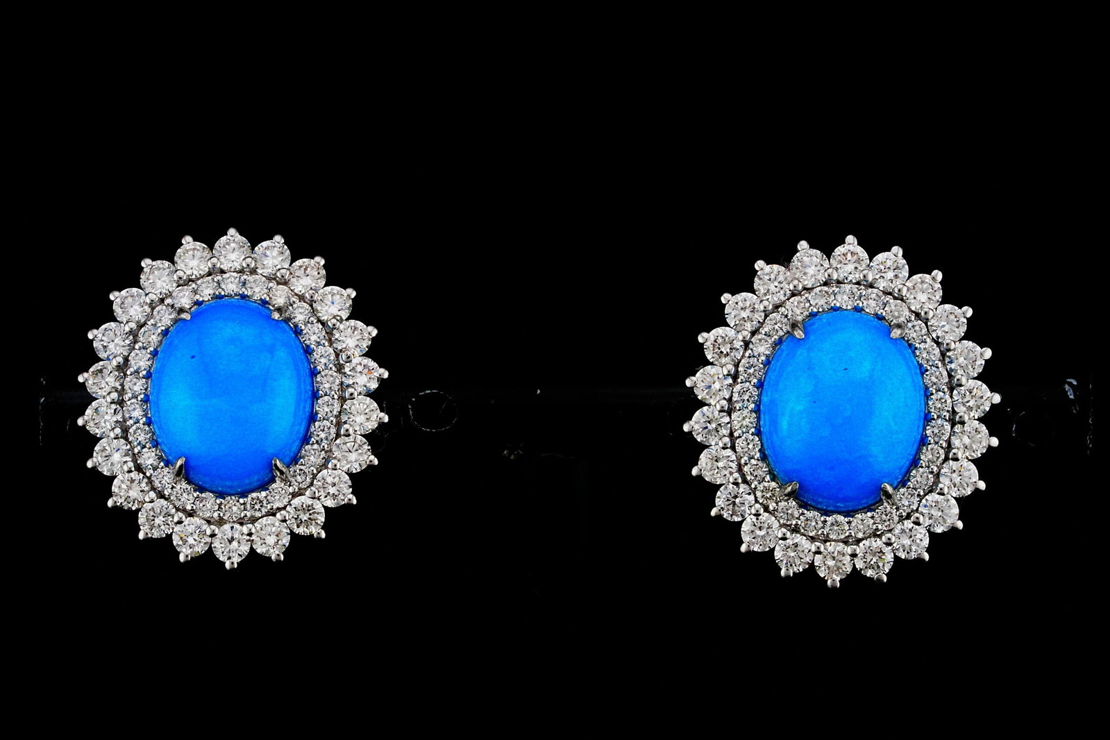 7.00ctw Turquoise, 2.50ctw Diamond and 18K Earrings: 7.00ctw Turquoise, 2.50ctw VS2-SI1/G-H Diamond and 18K White Gold 0.80" Earrings - THIS ITEM WILL COME WITH AN $11,000 INSURANCE VALUATION REPORT. Elegantly crafted in luxurious 18K white gold, these 