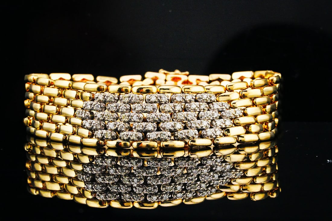 14K Yellow/White Gold and 0.60ctw Diamond Bracelet: 14K Yellow/White Gold and 0.60ctw Diamond 6.75" Link Bracelet - A refined balance of contrast, brilliance, and everyday elegance, this 14K Yellow and White Gold Diamond Link Bracelet is a timeless add