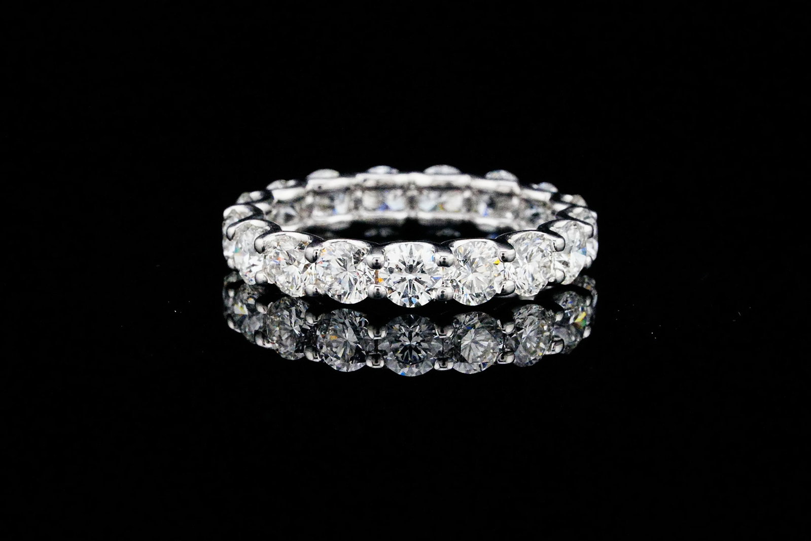 3.90ctw VS2-SI1/G-H Diamond and 14K Eternity Band: 3.90ctw VS2-SI1/G-H Round Brilliant Diamond and 14K White Gold 3.8mm Wide Eternity Band - THIS ITEM WILL COME WITH A $13,000 INSURANCE VALUATION REPORT. Beautifully crafted in polished 14K white gold,