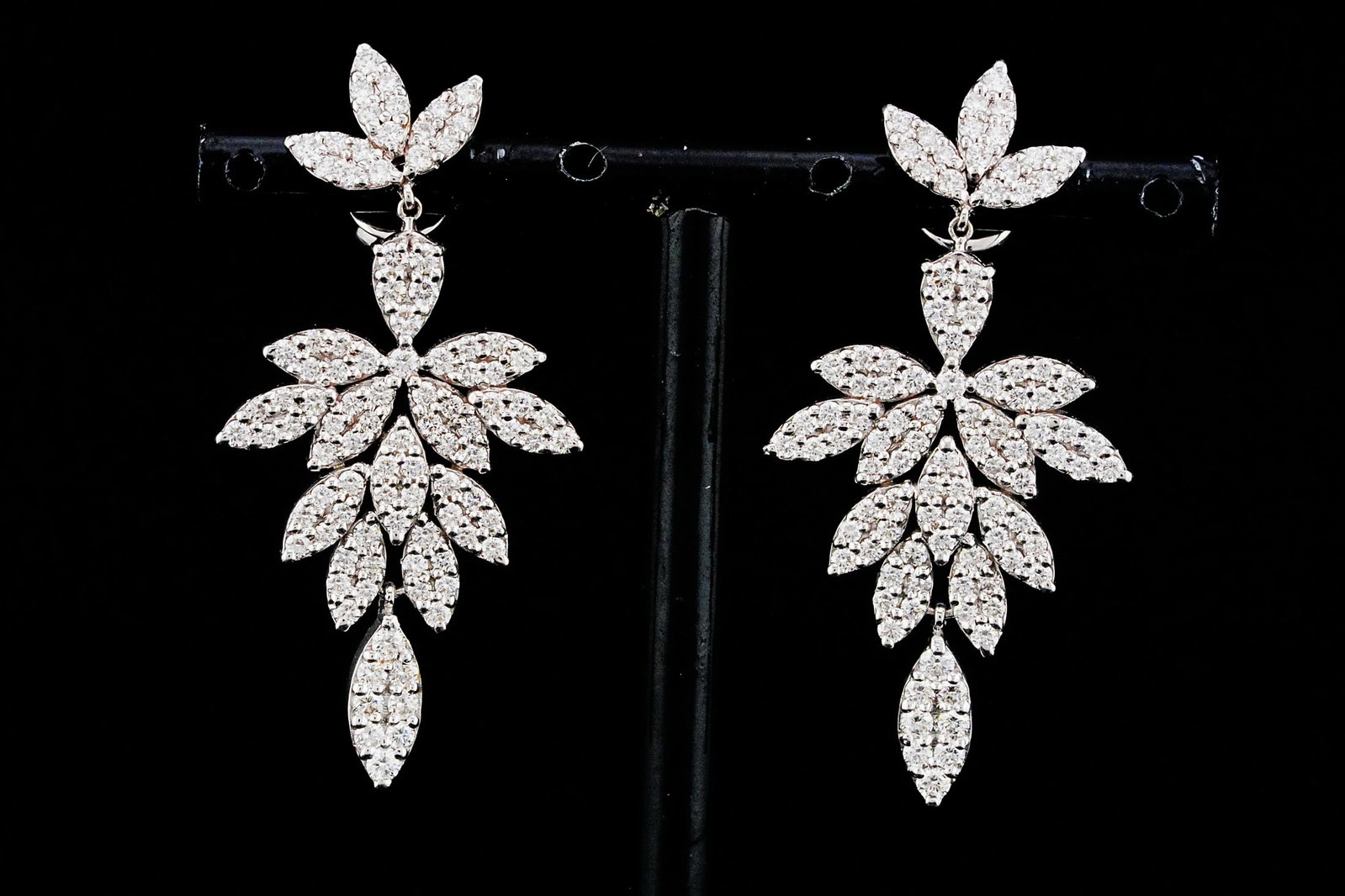 2.80ctw VS2-SI1/G-H Diamond and 18K 1.75" Earrings: 2.80ctw VS2-SI1/G-H Diamond and 18K White Gold 1.75" Dangle Earrings - THIS ITEM WILL COME WITH A $12,000 INSURANCE VALUATION REPORT. Elegantly crafted in polished 18K white gold, these sophisticated 