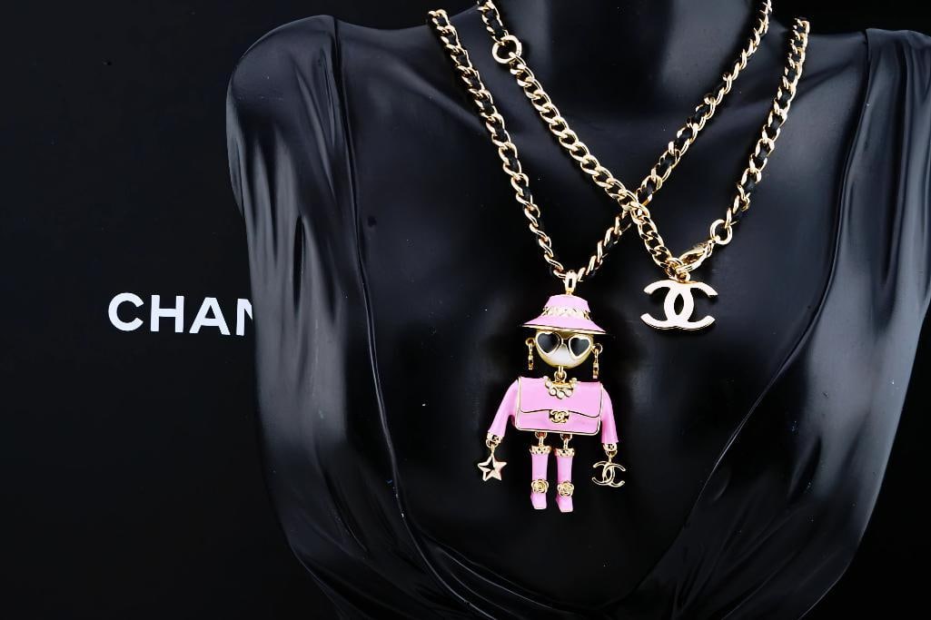 Chanel Limited Edition Coco Doll Necklace (Only 25 Made): Chanel Fall-Winter 2025/26 Pre-Collection Limited Edition Gold Tone Metal, Resin, Leather and Glass Pearl Coco Doll Pendant Necklace Unworn W/Original Packaging (Only 25 Produced) - An exceptionally r