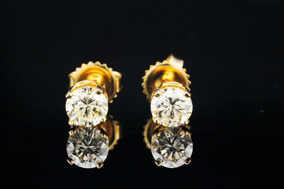 1.30ctw SI1-SI2/H-J Diamond and 14K Stud Earrings: 1.30ctw SI1-SI2/H-J Brilliant Round Cut Diamond and 14K Yellow Gold Stud Earrings - A timeless essential of understated luxury, these 14K yellow gold stud earrings feature approximately 1.30 carat tot