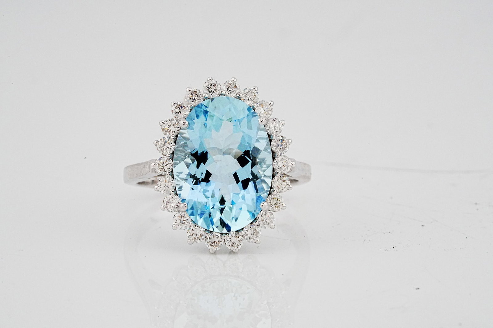 5.00ct Aquamarine, 0.65ctw Diamond and 18K Ring: 5.00ct Aquamarine, 0.65ctw VS1-SI1/G-H Diamond and 18K White Gold Ring - THIS ITEM WILL COME WITH A $12,000 INSURANCE VALUATION REPORT. Beautifully crafted in polished 18K white gold, this elegant rin