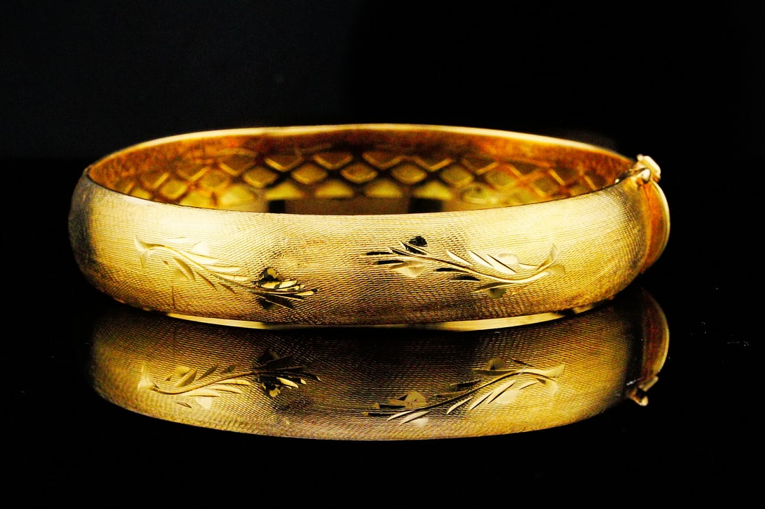 Solid 18K Yellow Gold 11mm Wide Bangle Bracelet: Solid 18K Yellow Gold 11mm Wide Bangle Bracelet - This elegant bangle showcases timeless Italian-inspired craftsmanship with a richly textured Florentine finish that gives the gold a soft, brushed bri