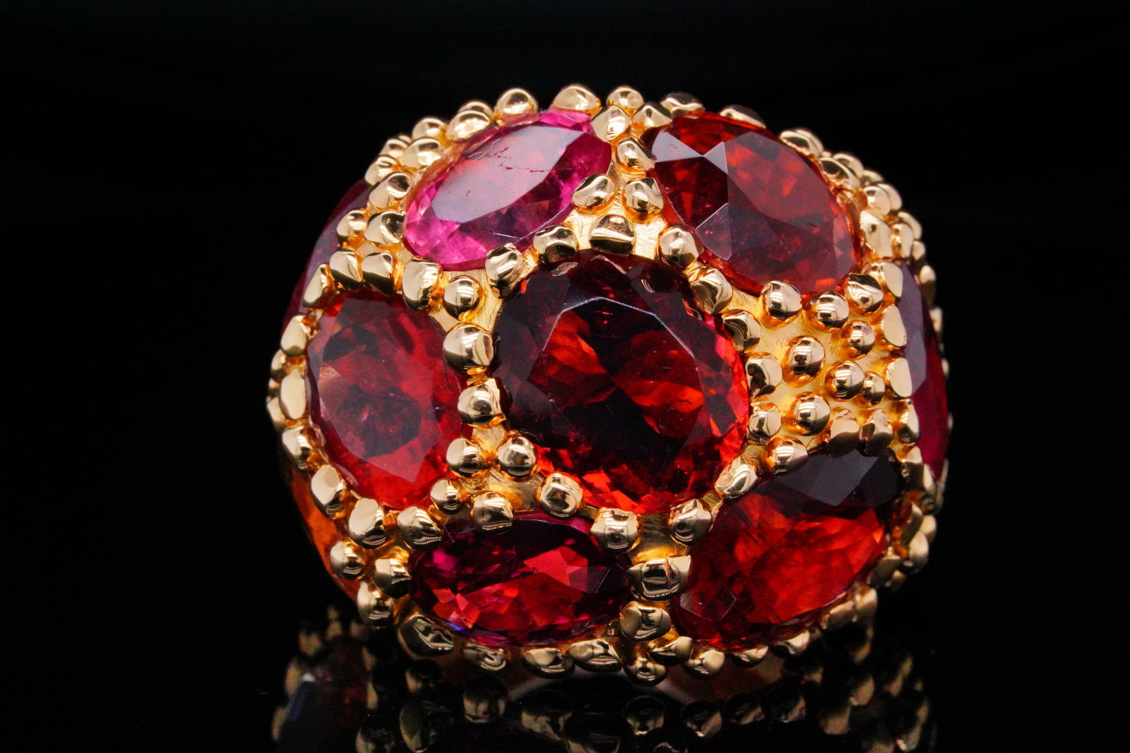 45.00ctw Pink Tourmaline and 18K Bombe Statement Ring: 45.00ctw Pink Tourmaline and 18K Yellow Gold Bombe Statement Ring - THIS ITEM WILL COME WITH A $13,000 INSURANCE VALUATION REPORT. This extraordinary bombe statement ring is masterfully crafted in sol