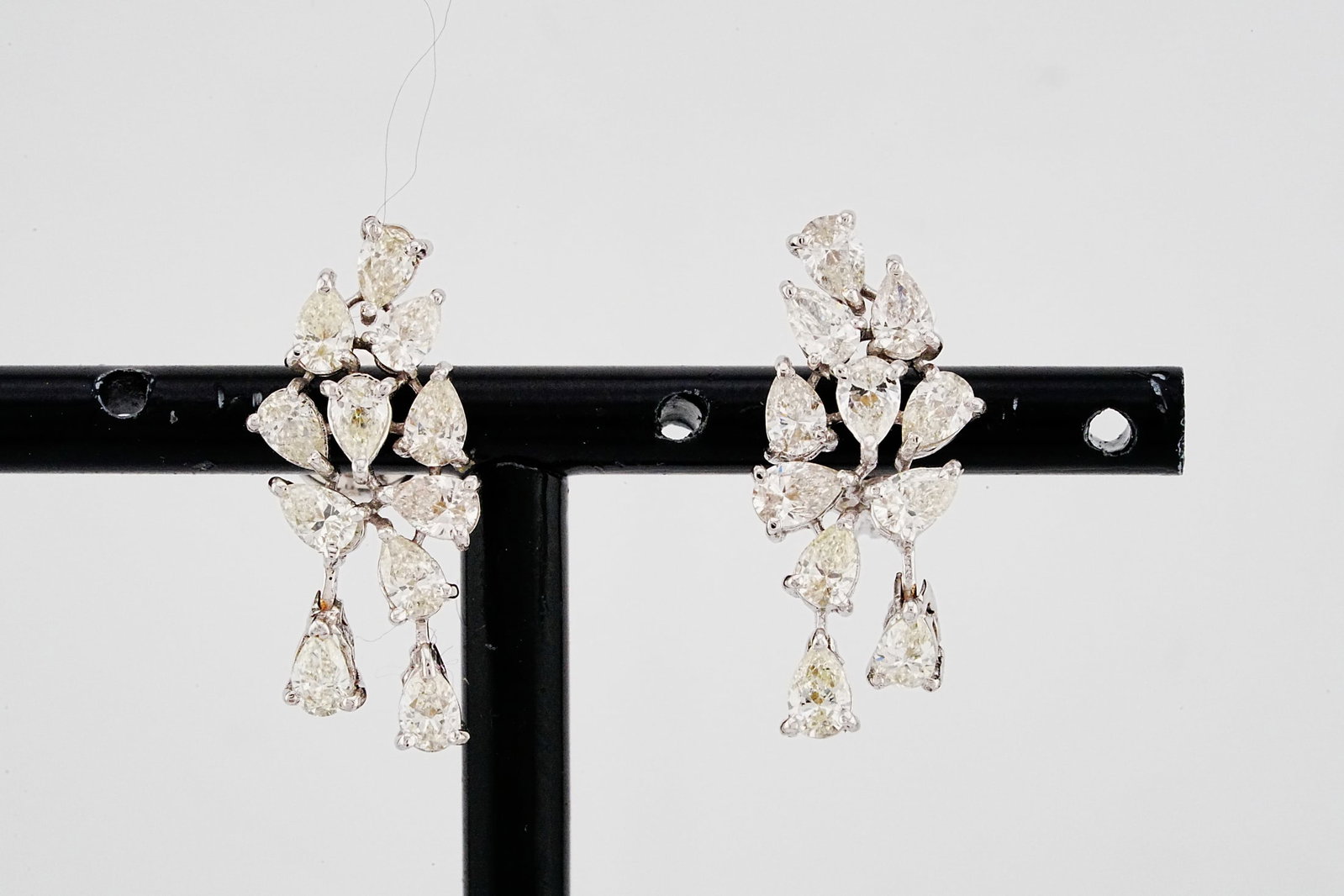 2.60ctw SI1-SI2/J-K Diamond and 18K White Gold Earrings: 2.60ctw SI1-SI2/J-K Diamond and 18K White Gold 1" Cluster Earrings - THIS ITEM WILL COME WITH AN $11,000 INSURANCE VALUATION REPORT. These elegant cluster earrings are finely crafted in luminous 18K w