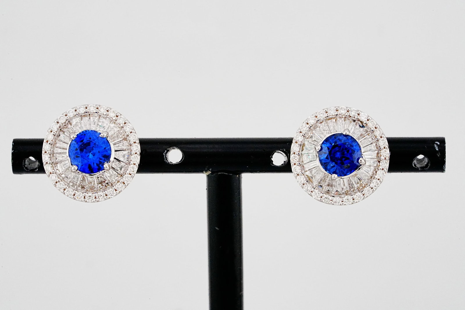 2.45ctw Blue Sapphire, 1.90ctw Diamond and 18K Earrings: 2.45ctw Blue Sapphire, 1.90ctw VS2-SI2/G-H Diamond and 18K White Gold 0.50" Stud Earrings - THIS ITEM WILL COME WITH A $13,500 INSURANCE VALUATION REPORT. These beautiful earrings are crafted in polis