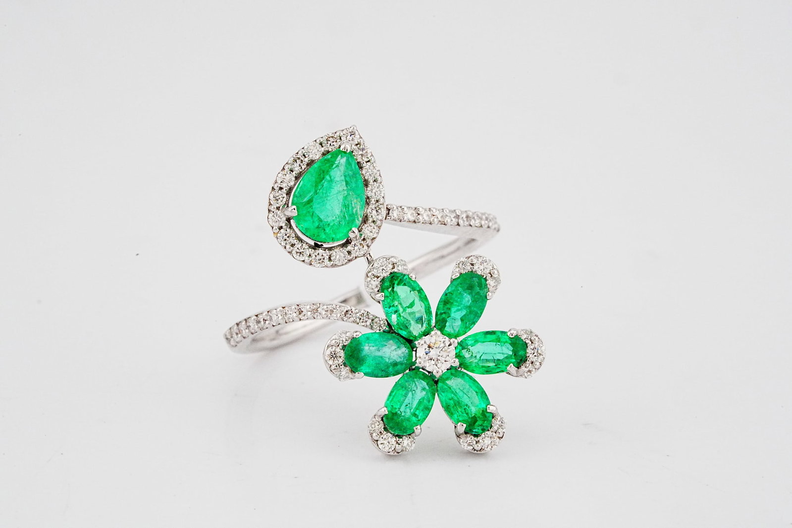 2.00ctw Emerald, 0.50ctw Diamond and 18K White Gold Ring: 2.00ctw Emerald, 0.50ctw Diamond and 18K White Gold Ring - THIS ITEM WILL COME WITH AN $8,000 INSURANCE VALUATION REPORT. This beautiful ring is crafted in 18k white gold and features a unique design 