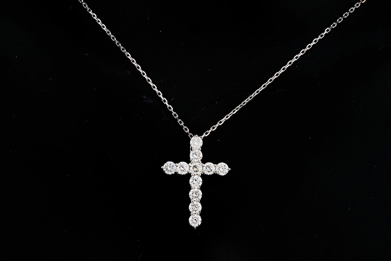 14K White Gold and 0.90ctw Diamond 19" Cross Necklace: 14K White Gold and 0.90ctw Diamond 19" Cross Pendant Necklace - This necklace is crafted in 14k white gold and showcases a 0.75" cross pendant lined with approximately 0.90ctw round brilliant diamonds