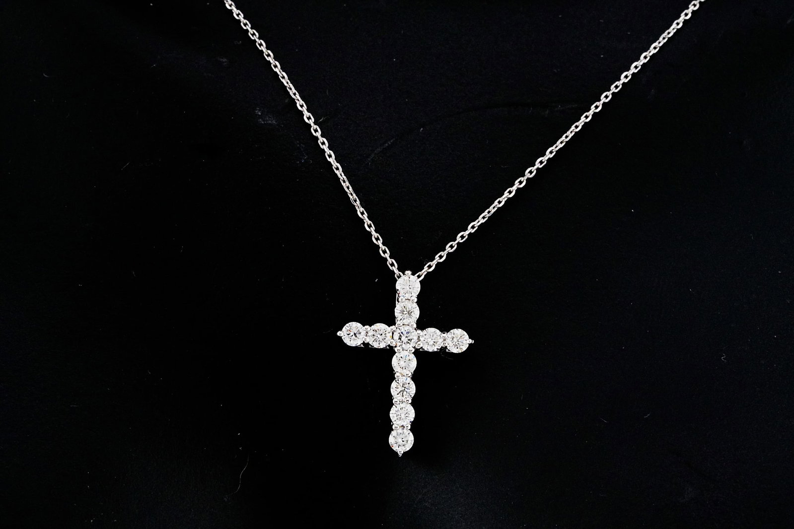 14K White Gold and 0.55ctw Diamond 19" Cross Necklace: 14K White Gold and 0.55ctw Diamond 19" Cross Pendant Necklace - This necklace is crafted in 14k white gold and showcases a 0.75" cross pendant lined with approximately 0.55ctw round brilliant diamonds