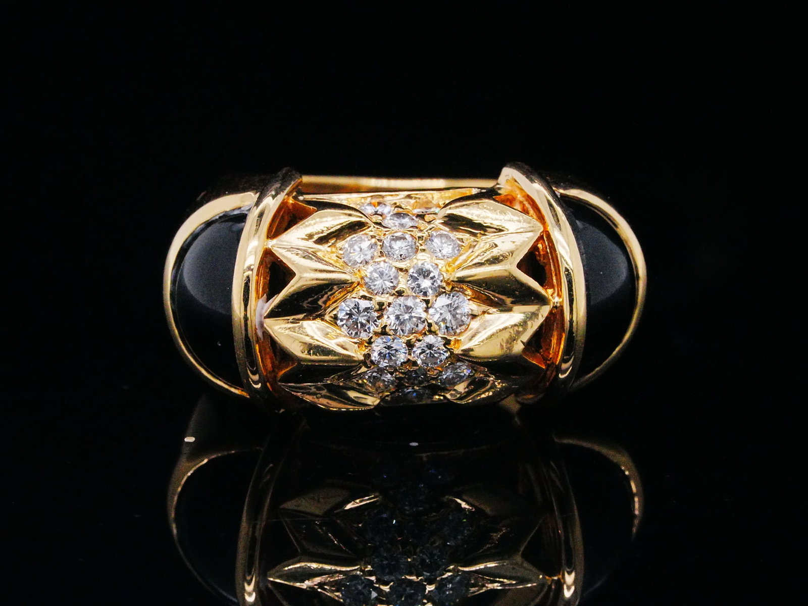 Modernist 0.60ctw Diamond, Onyx and 18K Gold Ring: Modernist 0.60ctw Diamond, Onyx and 18K Yellow Gold Ring - THIS ITEM WILL COME WITH A $6,750 INSURANCE VALUATION REPORT. A bold and sculptural modernist ring crafted in rich 18K yellow gold, showcasin