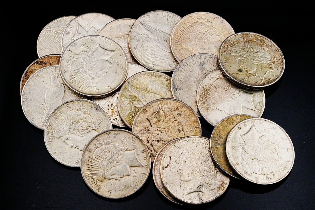 Lot of (40) Unsearched 90% Silver Peace Dollars: Lot of (40) Unsearched 90% Silver Peace Dollars (531.9 Grams) - This substantial lot features (40) genuine Peace Silver Dollars, each struck in 90% silver and representing the final chapter of classic