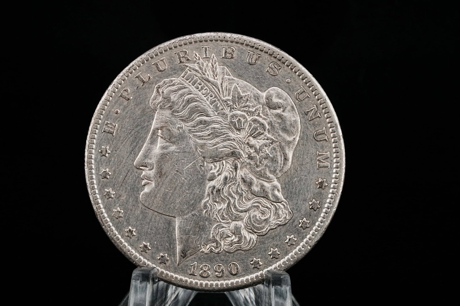 1890-CC Morgan Silver Dollar MS60-MS61 *Key Date*: 1890-CC Morgan Silver Dollar MS60-MS61 *Key Date* (90% Silver) - This coin is an 1890-CC U.S. Morgan Silver Dollar. This coin features a strong mint luster, sharp hairs and strong feathers. The coin