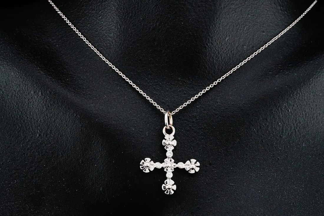 18K White Gold 16" Cross Pendant Necklace W/Diamonds: 18K White Gold 16" Cross Pendant Necklace W/Diamond Accents - This necklace is crafted in 18k white gold and features a cross pendant decorated with four diamond accents. Measurements: Chain-16" lengt