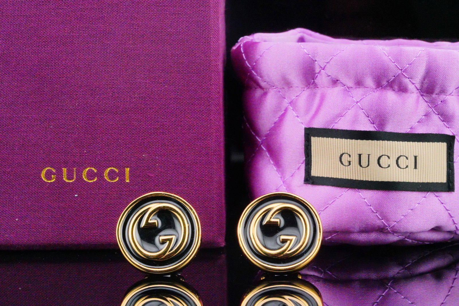 Gucci Gold Tone Double G Button Clip On Earrings: Gucci Gold Tone Double G Button Clip On Earrings With Enamel (Never Used W/Pouch and Box) - These stunning Gucci Gold Tone Double G Button Clip-On Earrings with black enamel exude timeless luxury and 