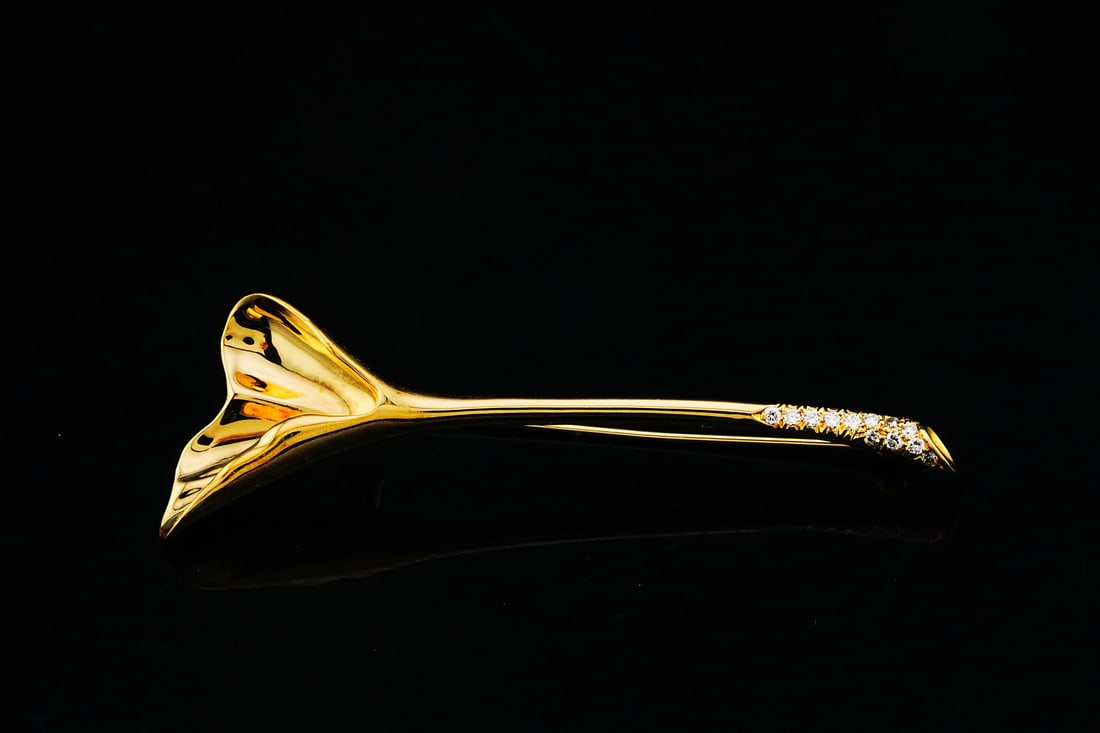 Tiffany & Co. 0.15ctw Diamond 18K Calla Lily Brooch: Tiffany & Co. 0.15ctw Diamond and 18K Yellow Gold 2.5" Calla Lily Brooch - Finely crafted in rich 18K yellow gold, this elegant brooch is designed as a graceful calla lily in bloom. The sculptural pet