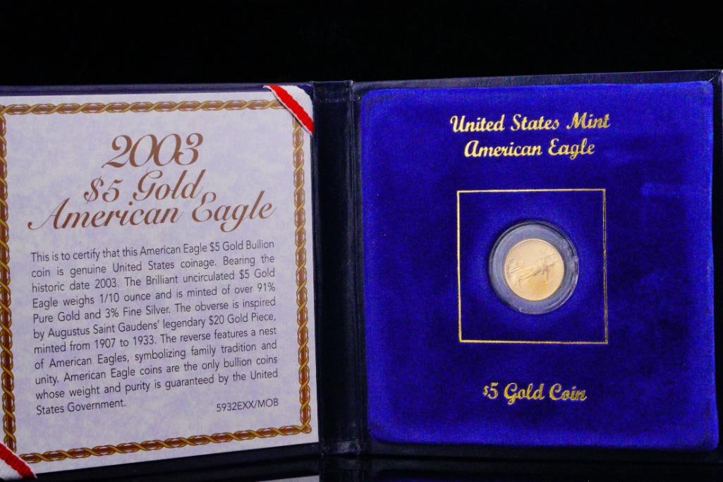 2003 American Gold Eagle 1/10 Oz $5 Gold Coin: 2003 American Gold Eagle 1/10 Oz $5 Gold Coin - This 2003 uncirculated American Eagle $5 coin was struck from 1/10 ounce of .9999 fine gold. Since its introduction, this classic and beloved design has
