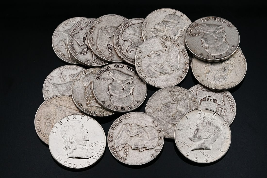 Lot of (18) 90% Silver U.S. Half Dollars, Unsearched: Lot of (18) 90% Silver U.S. Half Dollars, Unsearched (225 Grams) - Offered here is a lot of (18) genuine U.S. half dollars, each struck in 90% silver and confirmed as pre-1965 silver coinage. The grou