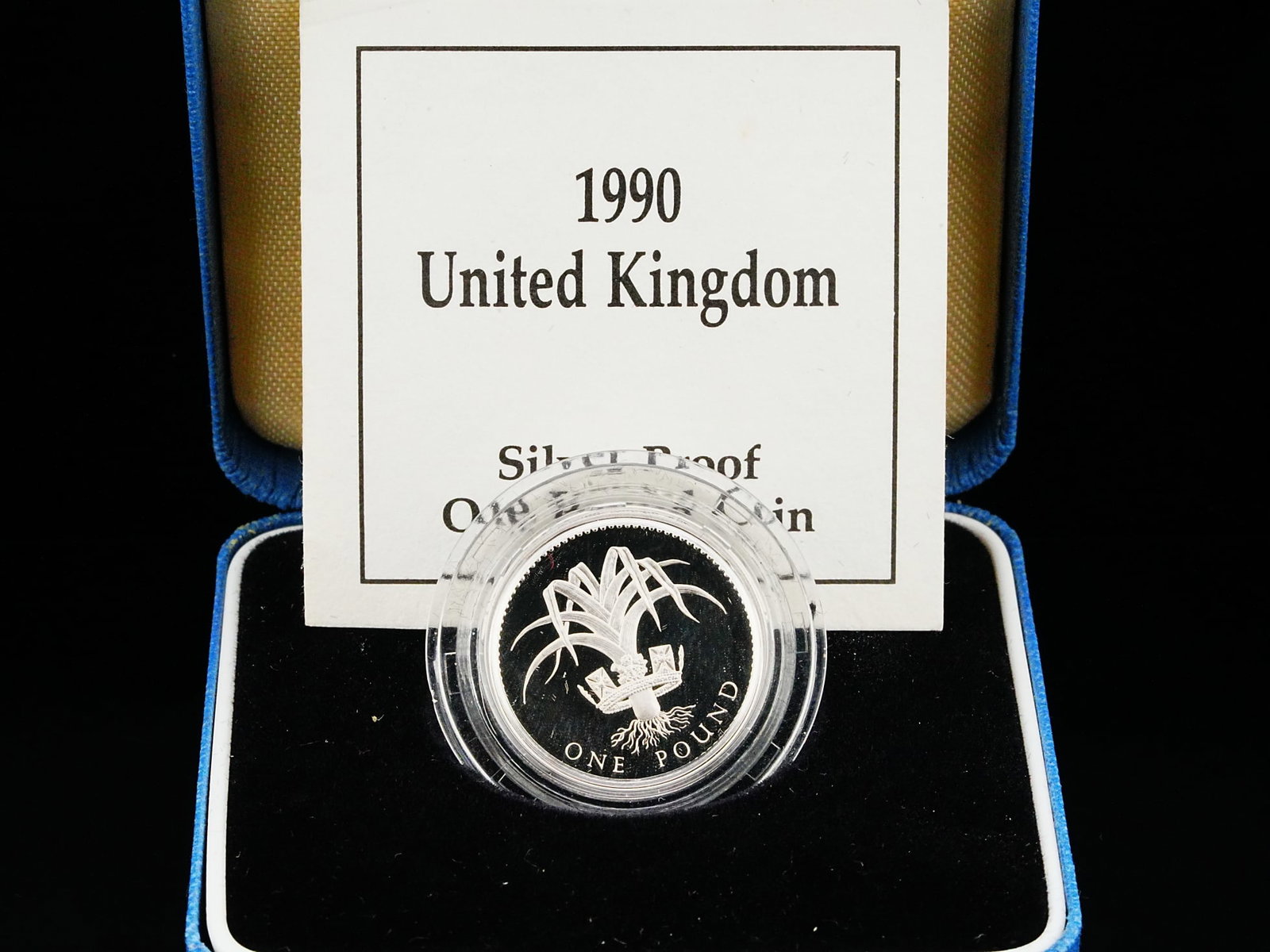 1990 Royal Mint UK $1 Pound Sterling Silver Proof Coin: 1990 Royal Mint United Kingdom $1 Pound Sterling Silver Proof Coin W/Box and COA - A beautifully produced 1990 United Kingdom $1 Pound Silver Proof Coin, issued by the renowned Royal Mint and presente