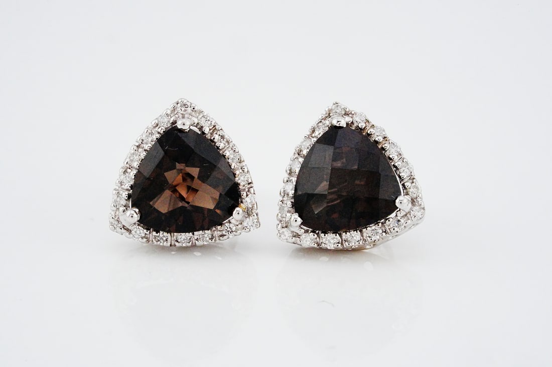3.50ctw Smoky Quartz, Diamond and 14K Earrings: 3.50ctw Smoky Quartz, 0.15ctw Diamond and 14K White Gold 0.50" Stud Earrings - These striking stud earrings showcase a sophisticated interplay of shape, color, and brilliance. At the center of each