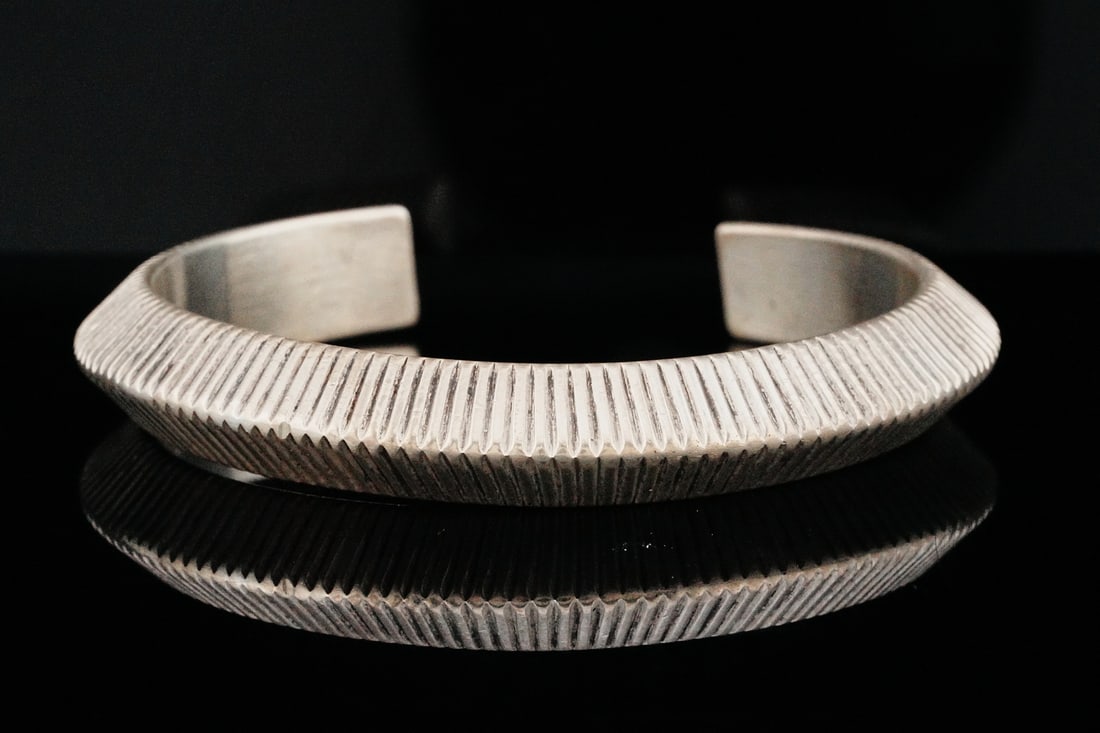 Herbert Ping Sterling Silver Cuff Bracelet: Herbert Ping Sterling Silver Cuff Bracelet - This distinctive cuff bracelet by Herbert Ping showcases the artist's signature sculptural style and refined craftsmanship. Expertly formed in solid sterli