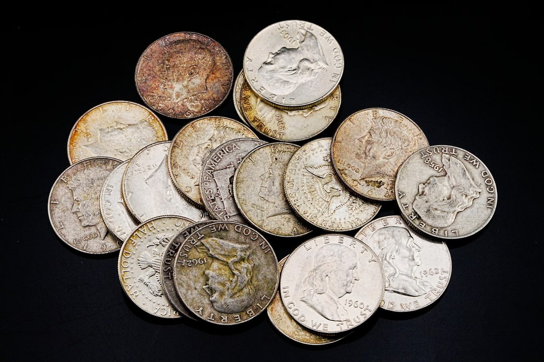 Lot of (20) Unsearched 90% Silver Half Dollars: Lot of (20) Unsearched 90% Silver Franklin and Kennedy Half Dollars (250.8 Grams) - This desirable lot features a mix of Franklin and early Kennedy Half Dollars, each struck in 90% silver composition.