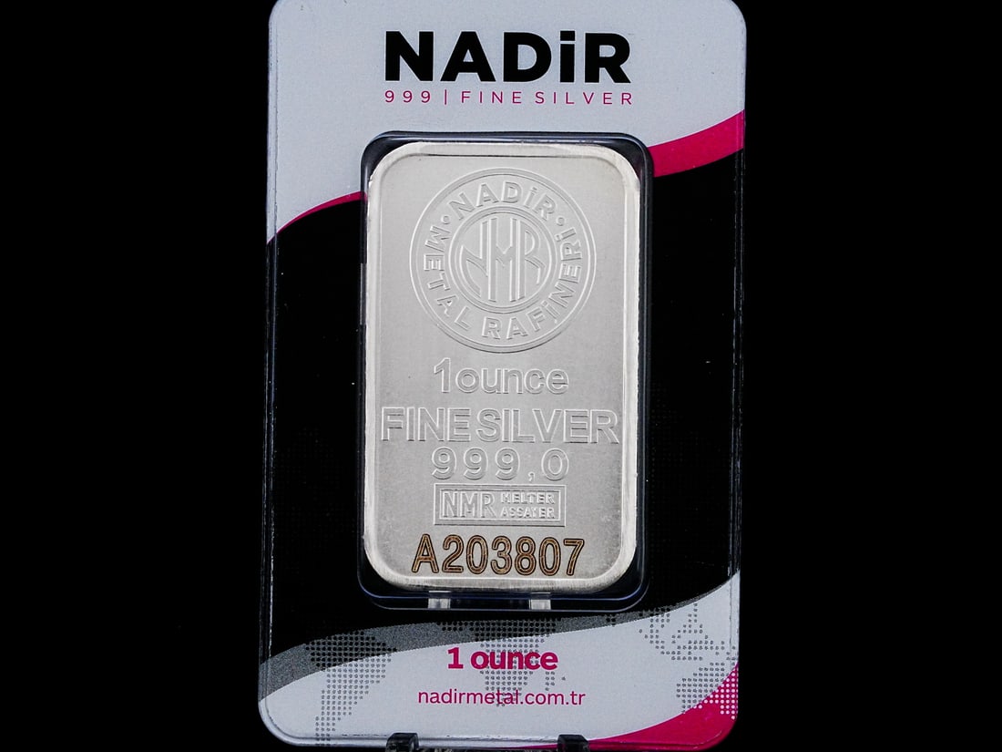 Nadir 1 Oz. .999 Fine Silver Bar in Certicard: Nadir 1 Oz. .999 Fine Silver Bar in Certicard - This bar is made of .999 Fine silver, is housed in a certicard and has a unique serial number. AUCTION NOTE: This item comes from the estate of Prince L