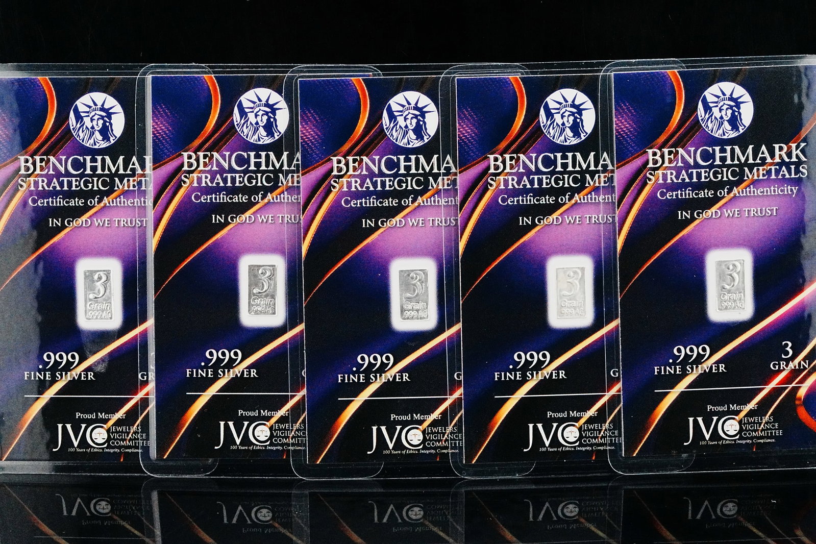 (5) Benchmark Strategic Metals 3 Grain .999 Silver Bars: Lot of (5) Benchmark Strategic Metals 3 Grain .999 Fine Silver Bars in Sealed Purple Lava Certificates - Unique fractional silver bullion offering comprising five Benchmark Strategic Metals 3 grain .9