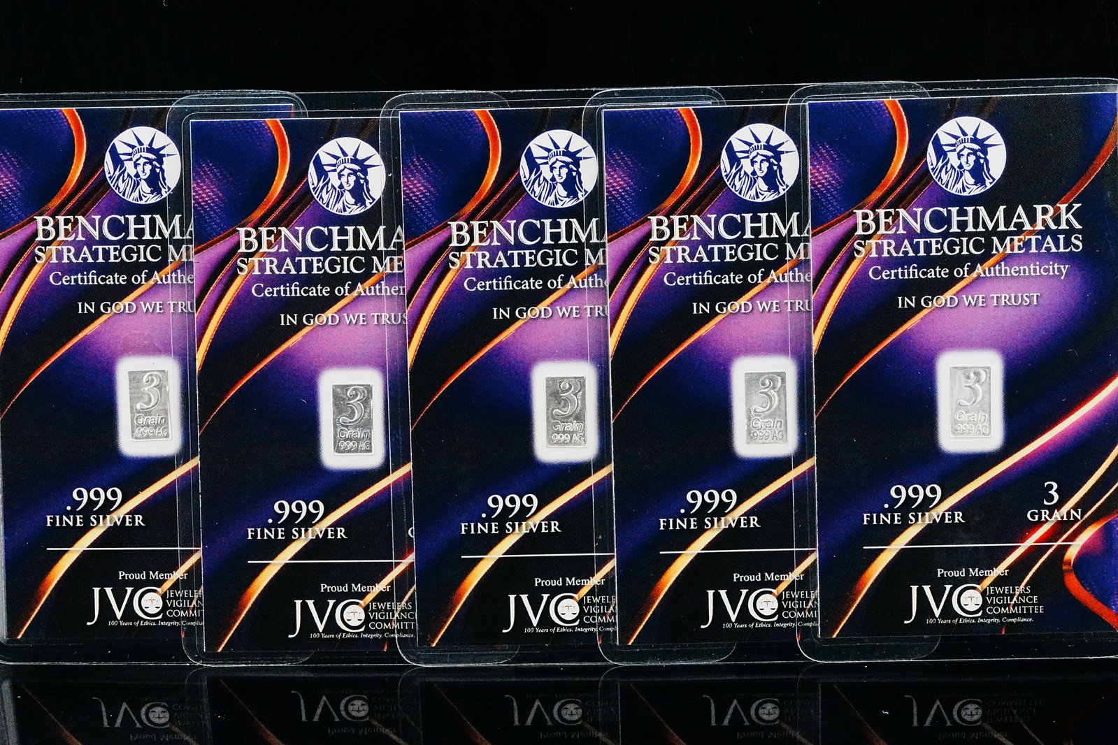 (5) Benchmark Strategic Metals 3 Grain .999 Silver Bars: Lot of (5) Benchmark Strategic Metals 3 Grain .999 Fine Silver Bars in Sealed Purple Lava Certificates - Unique fractional silver bullion offering comprising five Benchmark Strategic Metals 3 grain .9