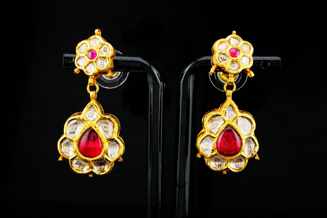 Handmade 1.05ctw Polki Diamond, 2.10ctw Ruby and 22K Earrings: Handmade 1.05ctw Polki Diamond, 2.10ctw Cabochon Ruby and 22K Yellow Gold 1.50" Drop Earrings - THIS ITEM WILL COME WITH AN $11,000 INSURANCE VALUATION REPORT. Exquisitely handcrafted in rich 22K yell
