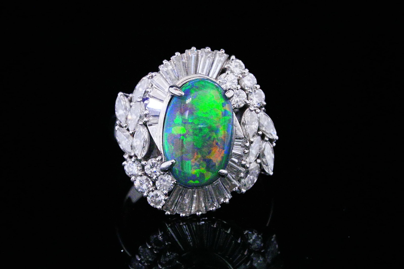 3.50ct Black Opal, 2.00ctw Diamond and Platinum Ring: 3.50ct Black Opal, 2.00ctw SI1-SI2/G-H Diamond and Solid Platinum Ring - THIS ITEM WILL COME WITH A $13,000 INSURANCE VALUATION REPORT. This ring is crafted of solid platinum and boasts an approximate