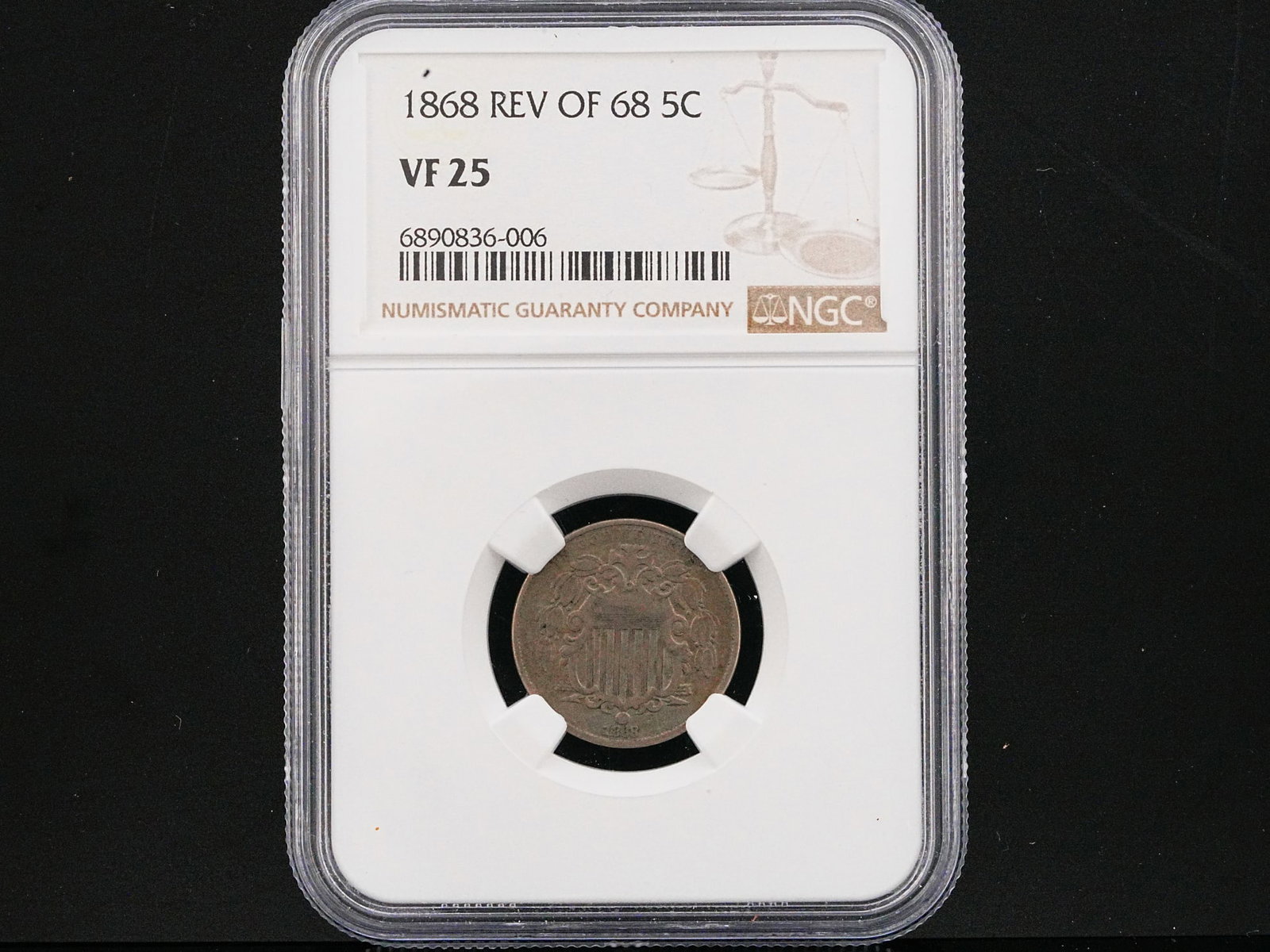 1868 Shield Nickel "Reverse of 1868" 5C NGC VF25: 1868 Shield Nickel "Reverse of 1868" 5C NGC VF25 - A compelling early issue from America's first nickel five-cent series, this 1868 Shield Nickel represents a fascinating chapter in post-Civil War Uni