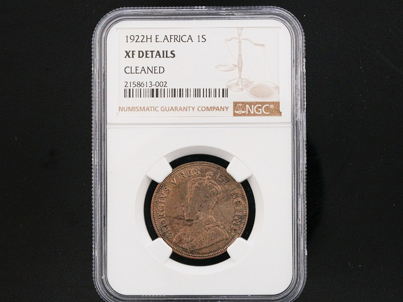 1922H East Africa 1 Shilling NGC XF Details Cleaned: 1922H East Africa 1 Shilling NGC XF Details Cleaned - A tangible artifact of the British Empire's East African colonial era, this 1922H East Africa One Shilling offers both historical resonance and en
