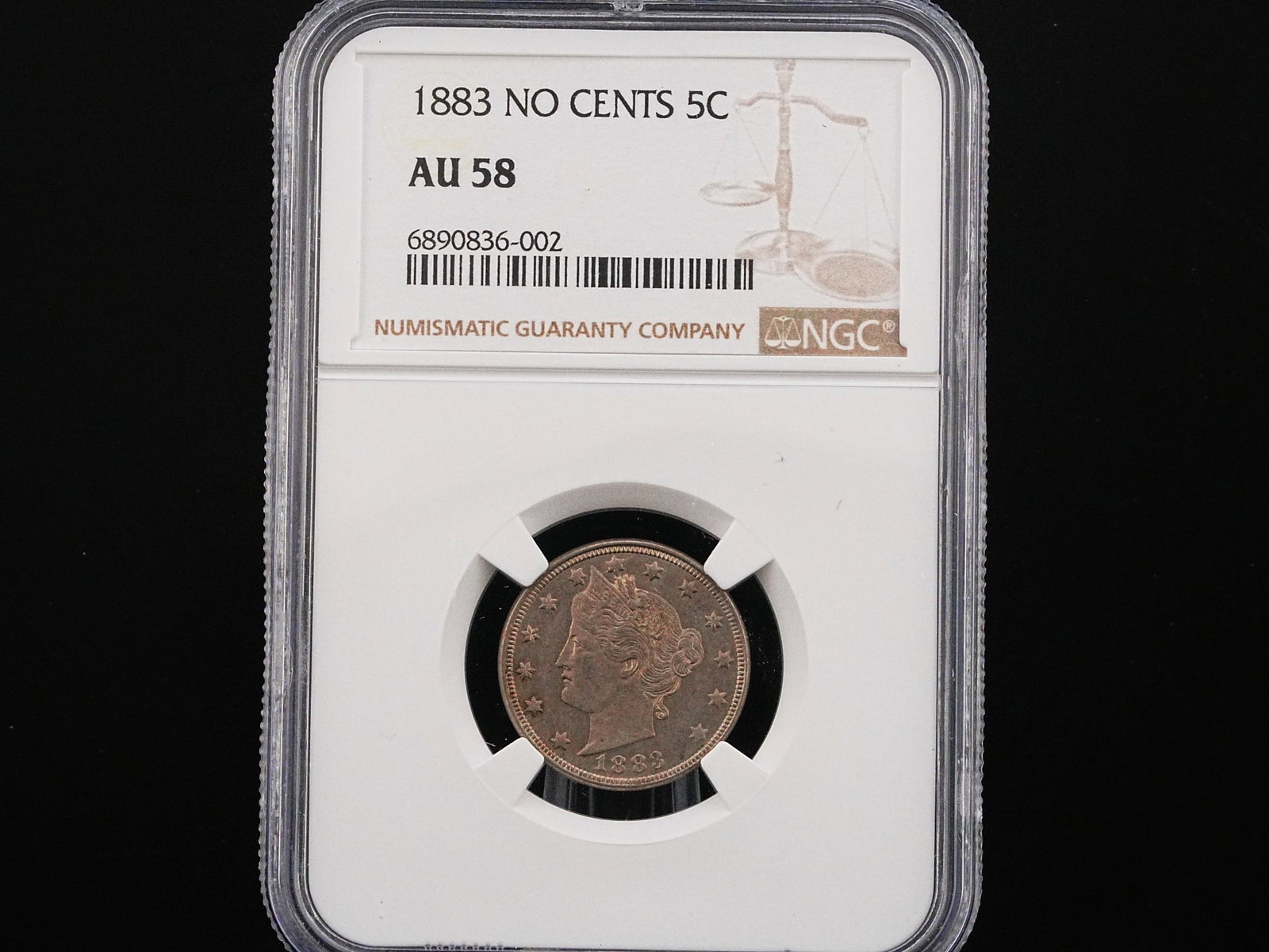 1883 "No Cents" Liberty Head Nickel 5C NGC AU58: 1883 "No Cents" Liberty Head Nickel 5C NGC AU58 - One of the most famous and instantly recognizable transitional issues in American numismatics, this 1883 "No Cents" Liberty Head Nickel represents a c