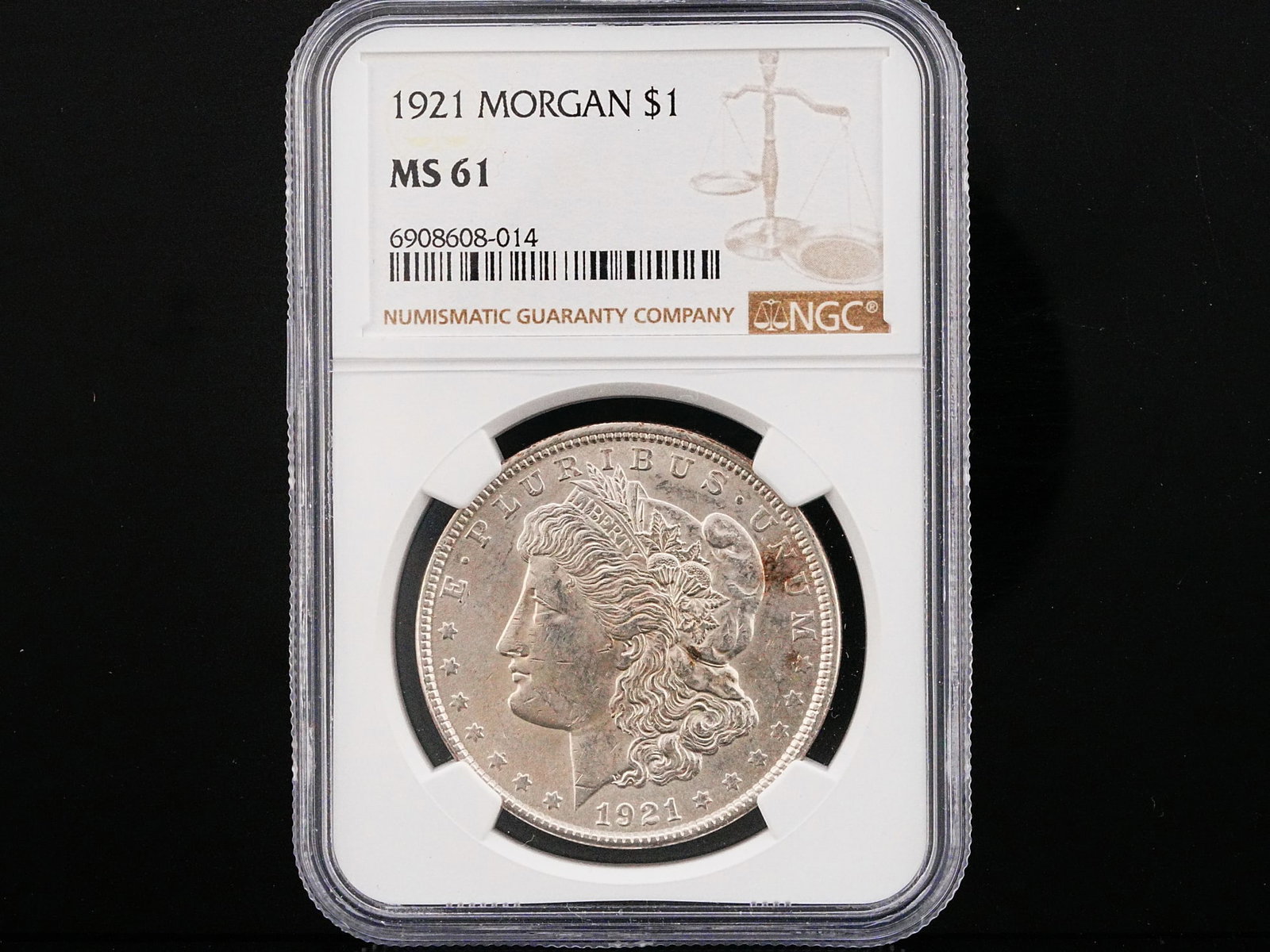 1921 Morgan Silver Dollar NGC MS61 Last Year Issue: 1921 Morgan Silver Dollar NGC MS61 Last Year Issue - A historic final-year issue from one of the most celebrated coin series in American numismatics, this 1921 Morgan Silver Dollar represents the clos