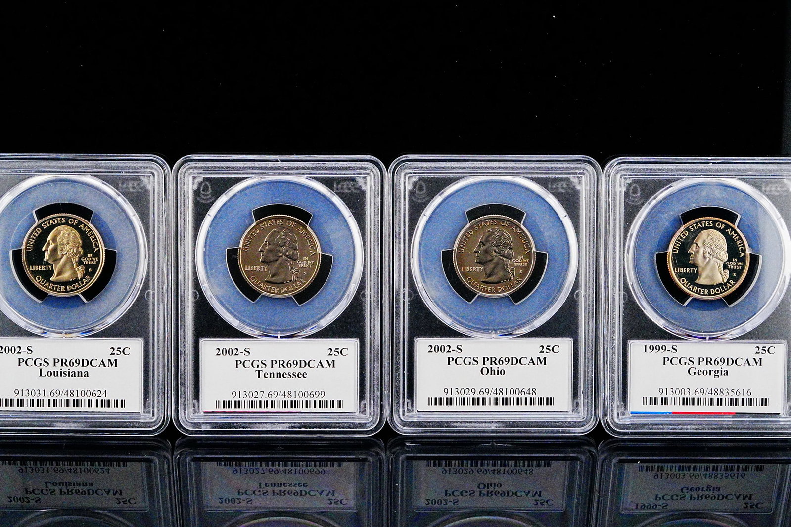 Lot of (4) PCGS PR69DCAM State Quarter Proofs: Lot of (4) PCGS PR69DCAM State Quarter Proofs - An attractive certified grouping from one of the most widely collected modern United States coin programs, this four-piece State Quarter proof collectio