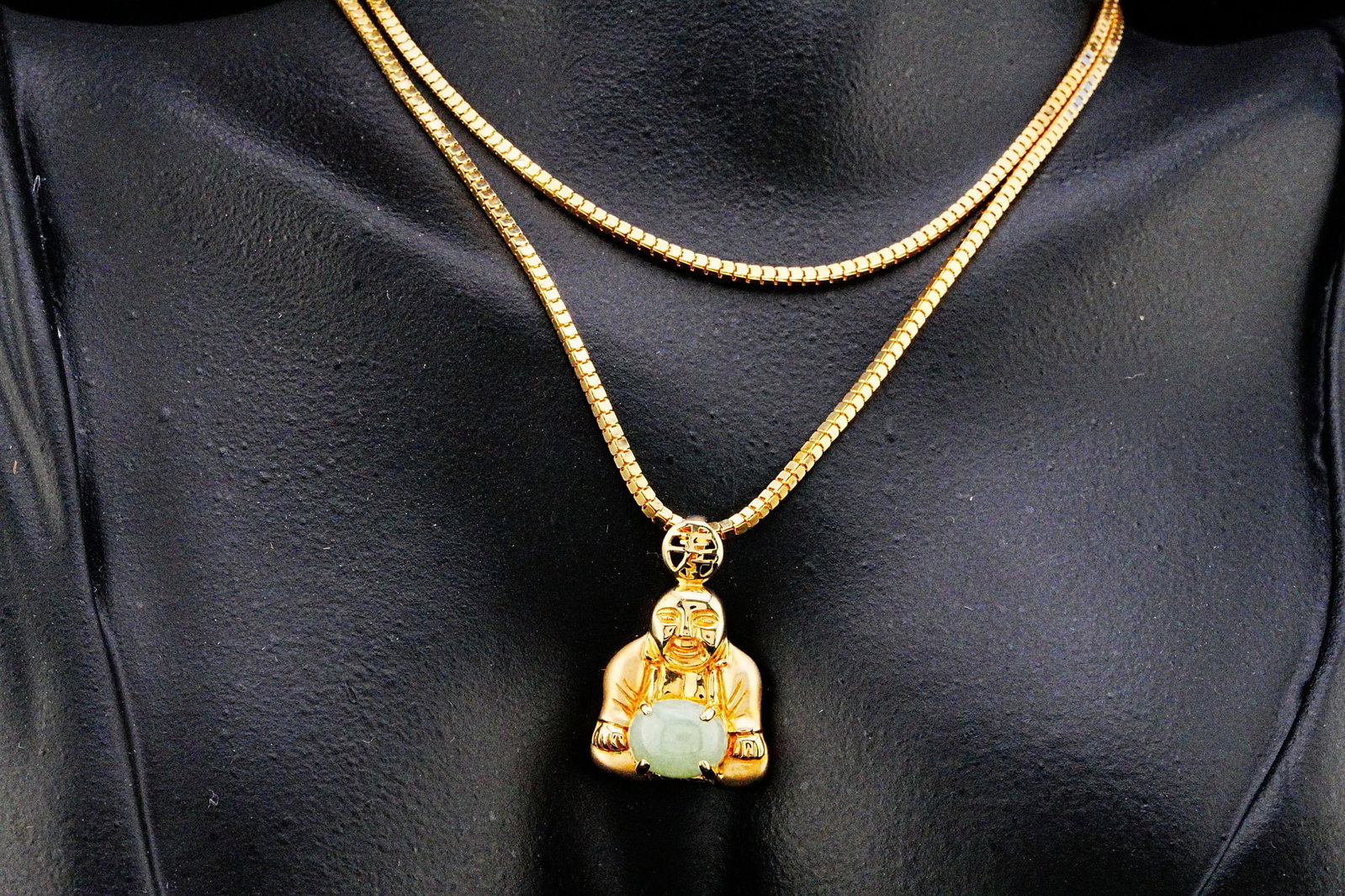 14K Yellow Gold and 9mm Jade 22" Buddha Pendant Necklace: 14K Yellow Gold and 9mm Jade 22" Buddha Pendant Necklace - A meaningful expression of prosperity, harmony, and enduring elegance, this finely crafted 14K yellow gold necklace features a striking figur