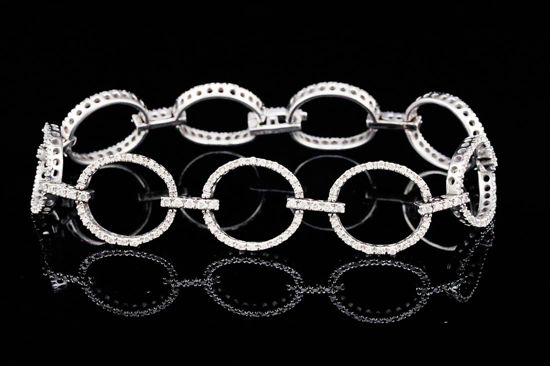 1.50ctw Diamond and 14K White Gold 6.75" Bracelet: 1.50ctw Diamond and 14K White Gold 6.75" Circle Link Bracelet - This elegant bracelet is defined by its refined circle link design, where each polished 14K white gold link is seamlessly connected to c