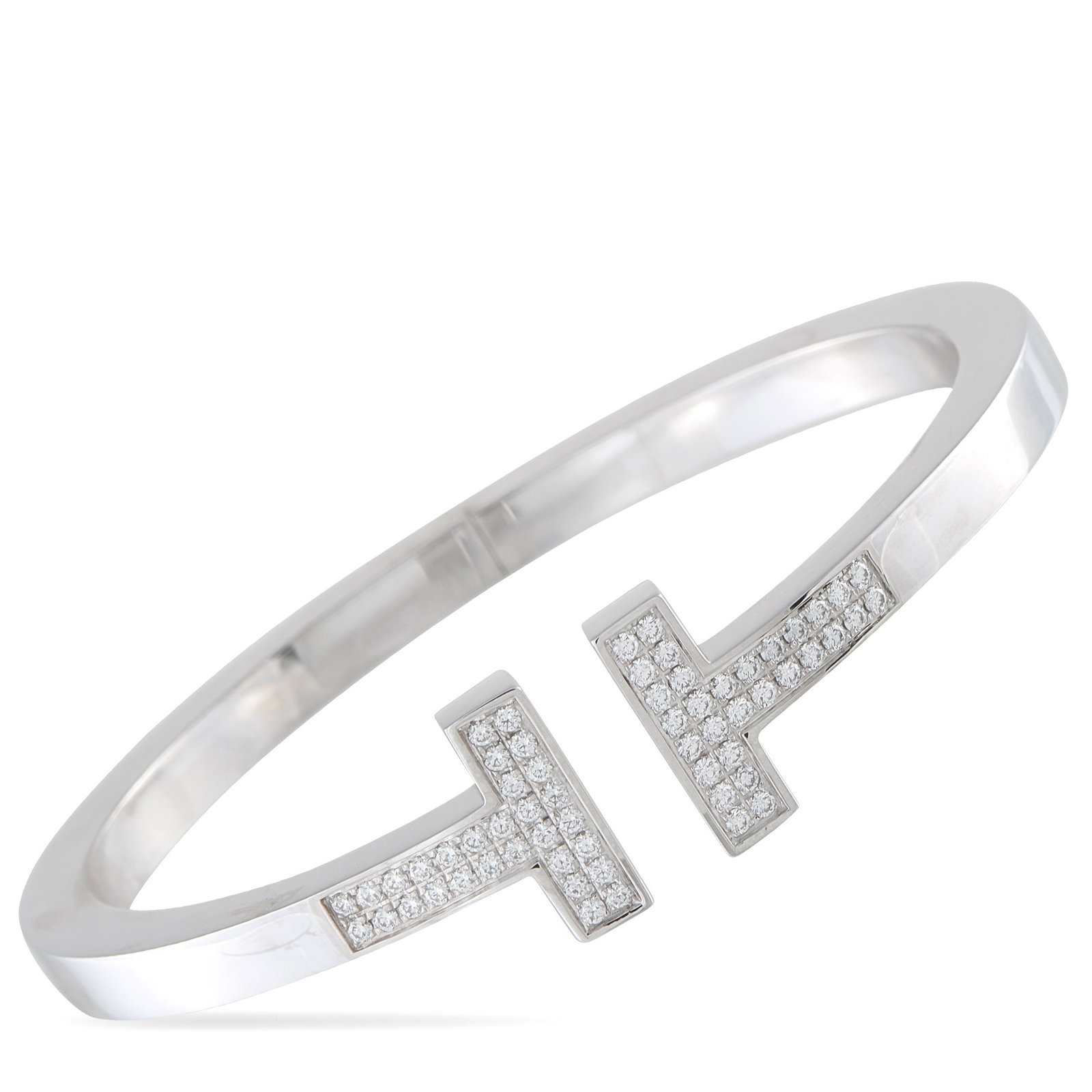 Tiffany & Co. Tiffany T 0.74ctw Diamond and 18K Bracelet: Tiffany & Co. Tiffany T 0.74ctw VS/F-G Diamond and 18K White Gold Square Bracelet - A modern icon of refined sophistication, this Tiffany & Co. Tiffany T bracelet showcases the collection's clean arch