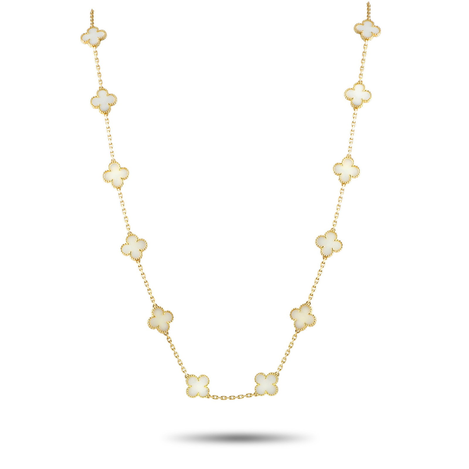Van Cleef & Arpels White Coral, 18K 20-Motif Necklace: Van Cleef & Arpels Vintage Alhambra White Coral and 18K Yellow Gold 20-Motif Necklace - From the Alhambra Collection, this vintage necklace, circa 1980s, gathers twenty motifs, set along a 32-inch-lon